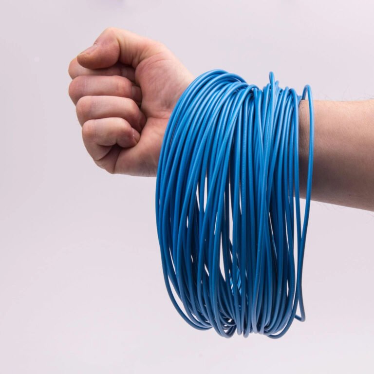 Blue electrical wire wrapped around arm.